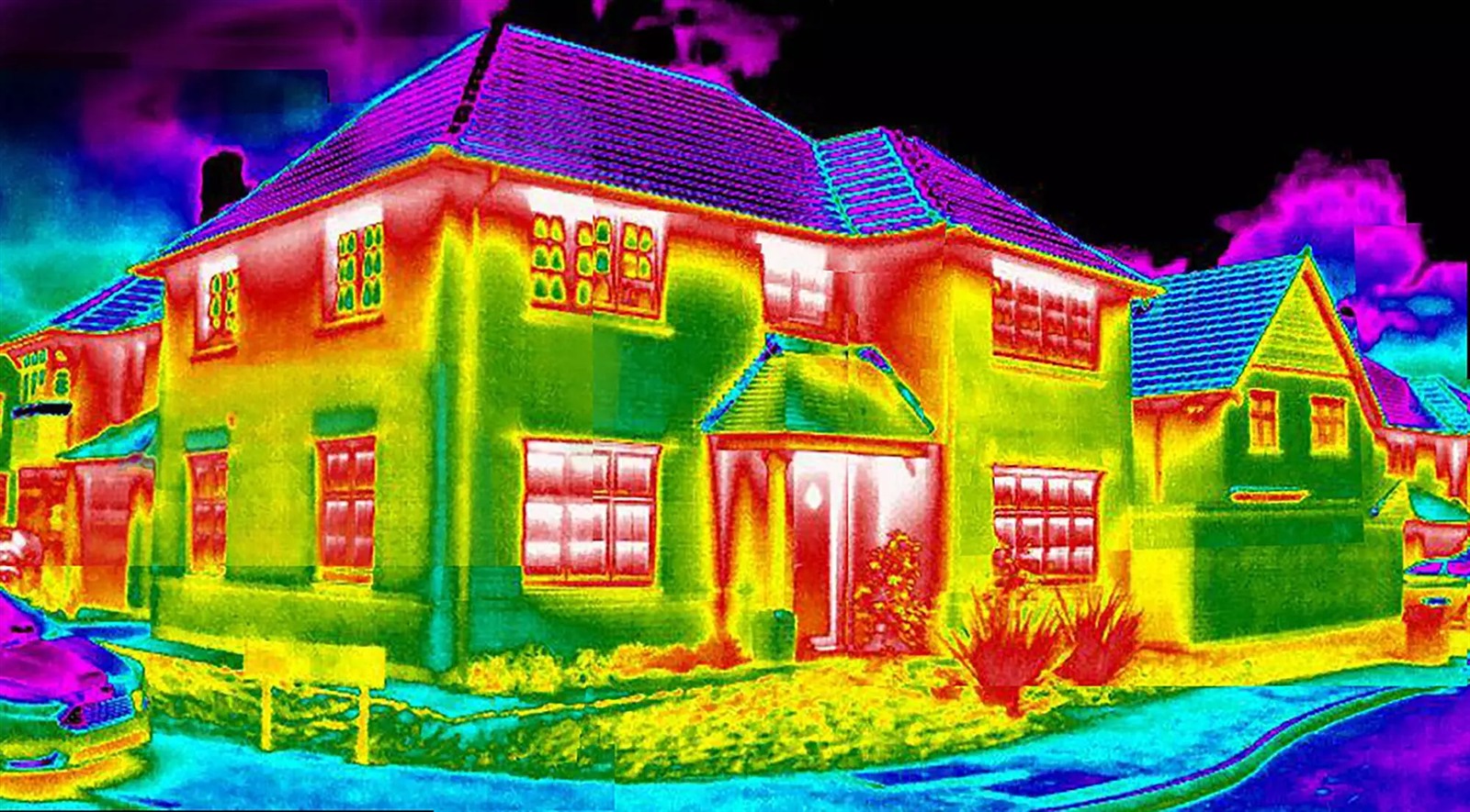 Illustrative thermal image of a two-storey house, showing different colours across its walls, roof and windows